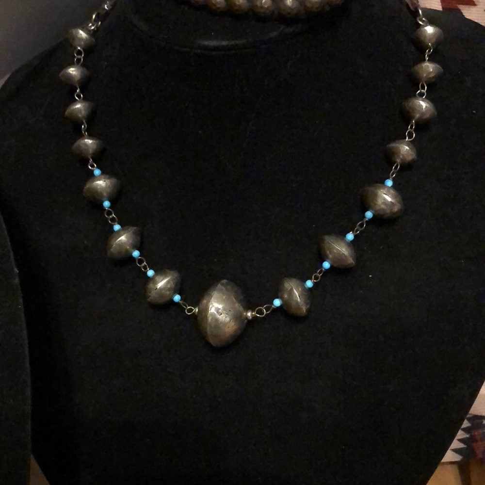Beautiful Bicone Sterling silver bead with Kingman turquoise spacer beads.